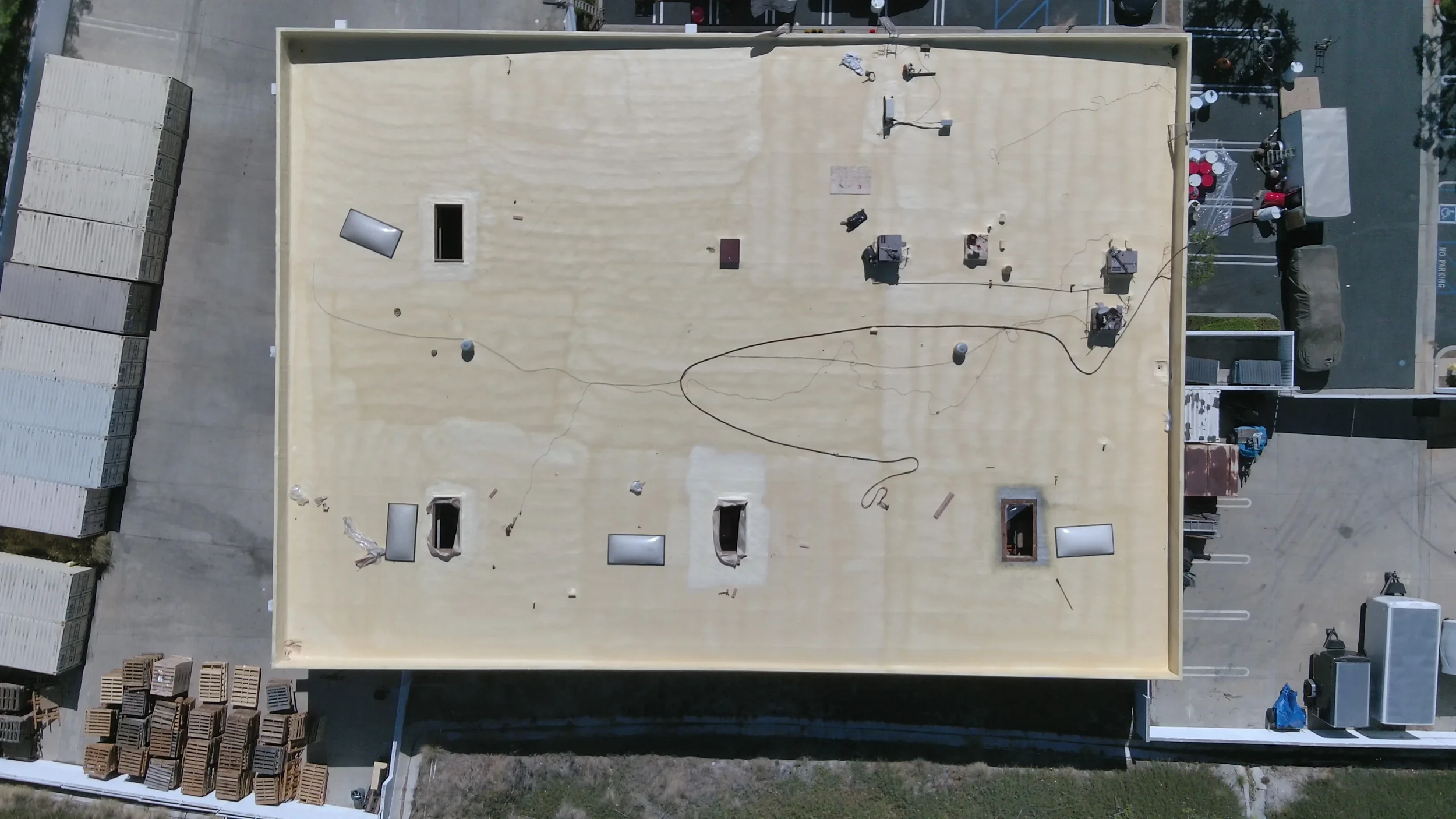 Aerial view of a commercial foam roof before restoration