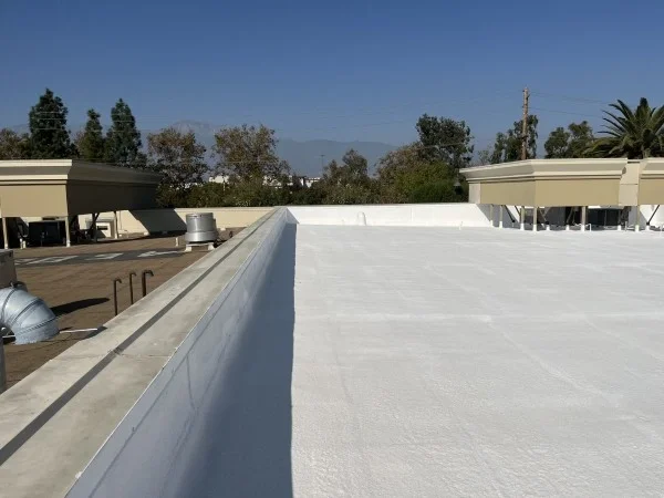 Completed commercial white reflective flat roofing system