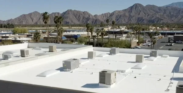White commercial flat roof with multiple HVAC units