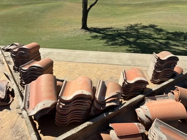 Stacked roof tiles during a reroofing project