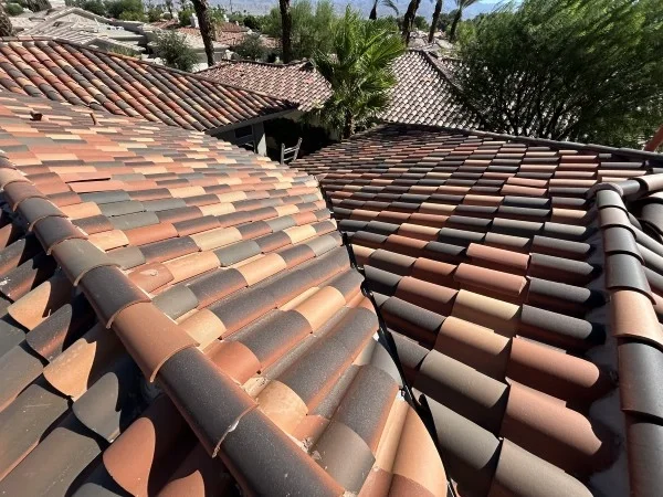 Newly installed clay tile roof with completed professional craftsmanship.