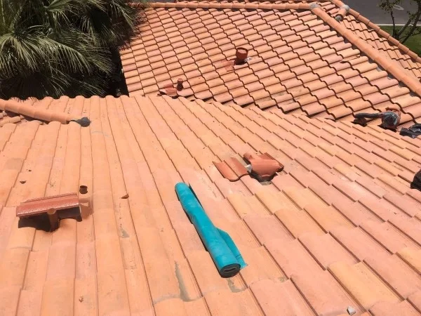 Tile roof repairs underway