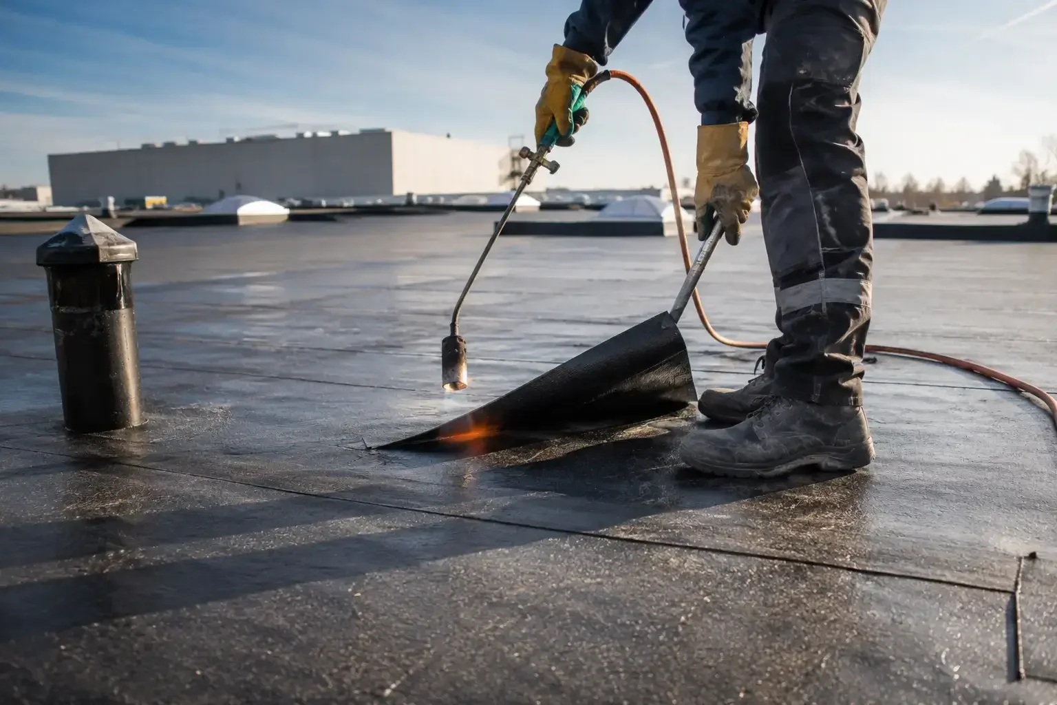Commercial roofers installing flat roofing system