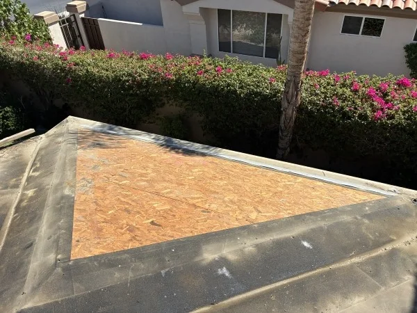 Roof deck sheathing prepared for new roofing system installation