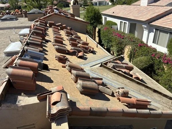 Tile roof deck prepared for underlayment and tile replacement.