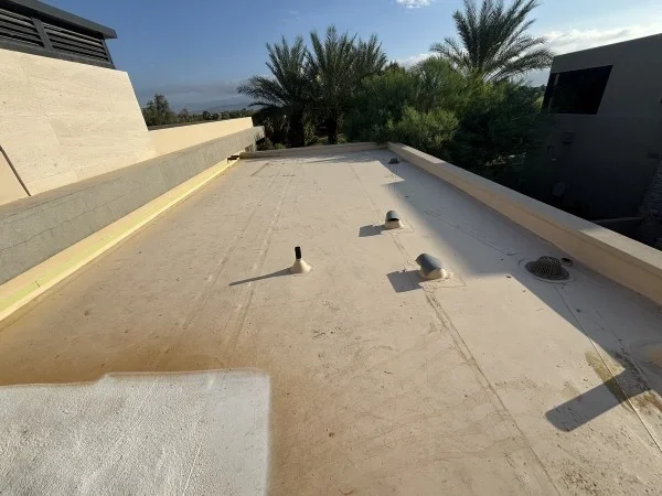 Residential flat roof before reflective coating application and restoration.
