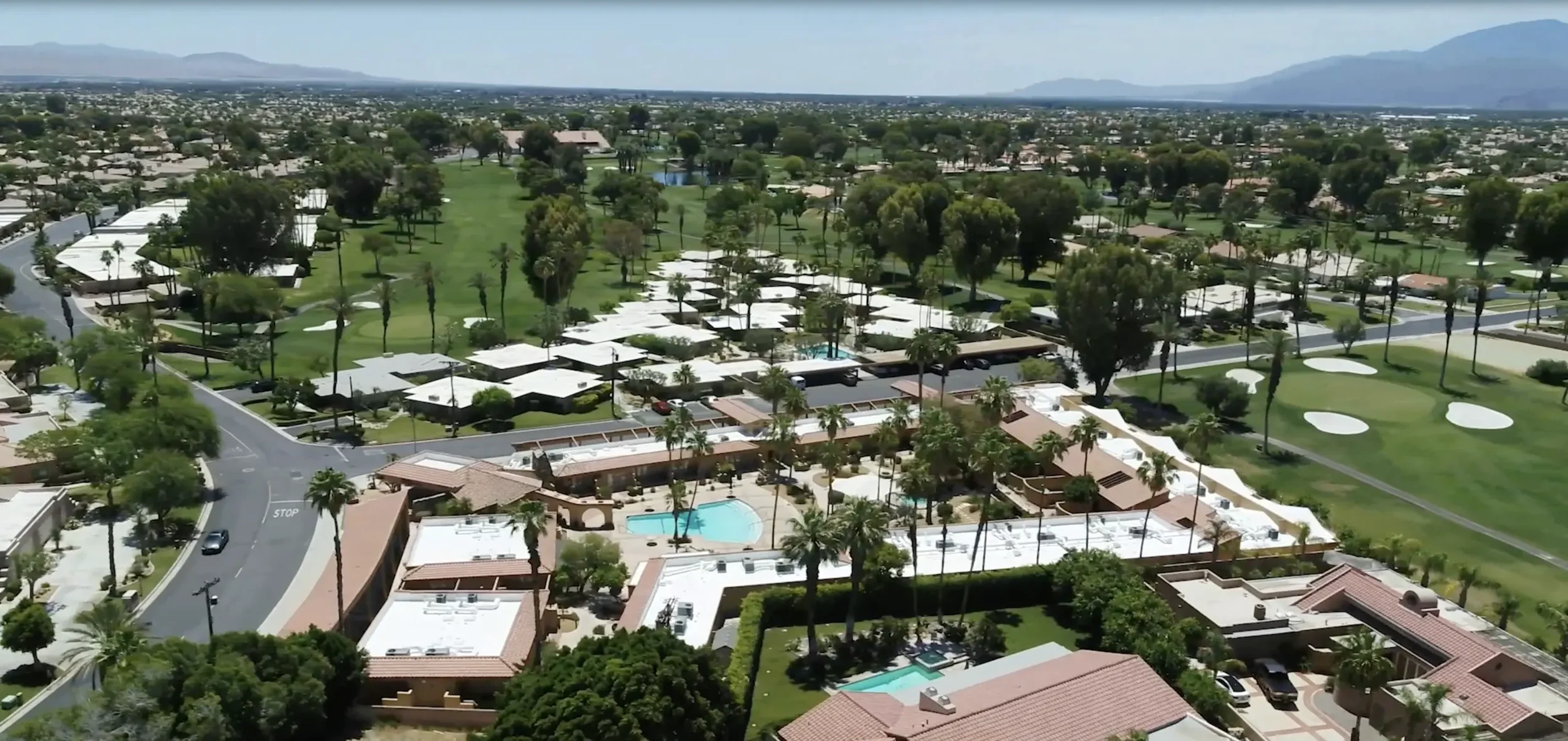 Aerial view of Palm Desert homes and surrounding rooftops