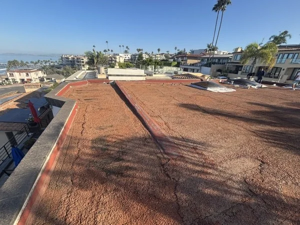 Existing flat roof prepared before reflective roof coating installation.