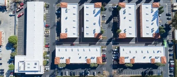 Aerial view of multiple white commercial building roofs