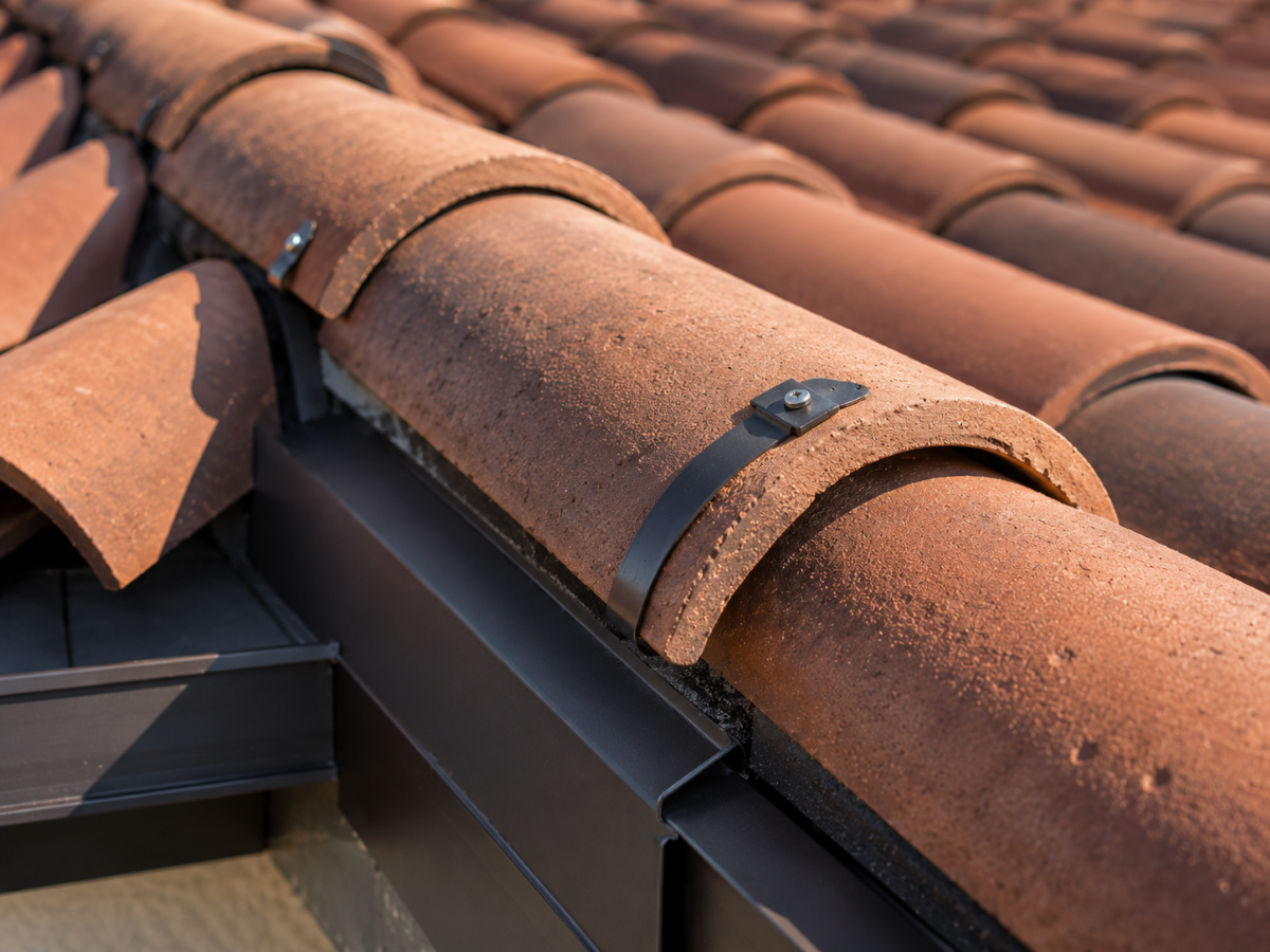 New clay tile ridge with wind clips and flashing on a Santa Ana re-roof