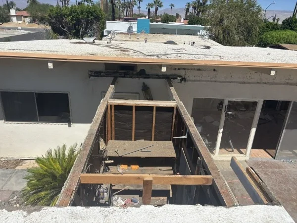 Residential roof framing exposed during major renovation and reroofing.