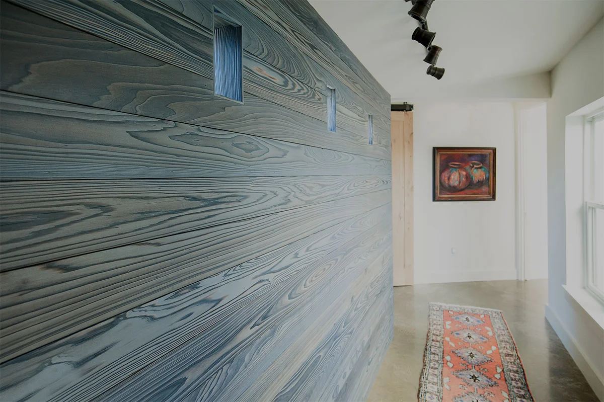 Shou Sugi Ban (Japanese burned wood) accent wall at connector hallway to master wing