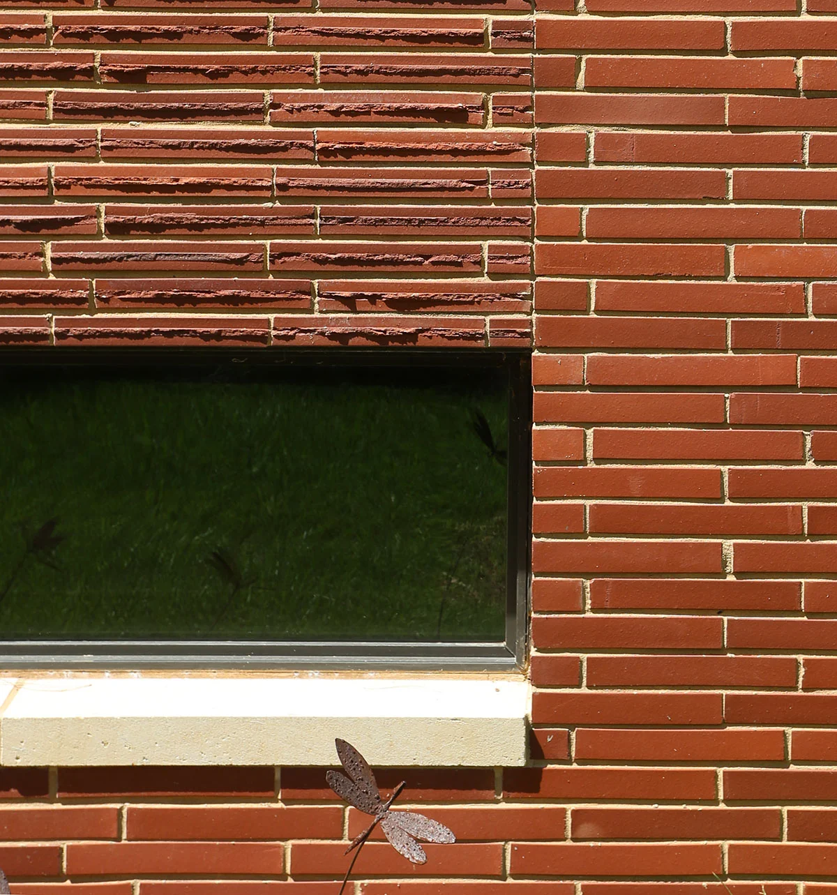 Textured and smooth red roman brick at dining room pavilion