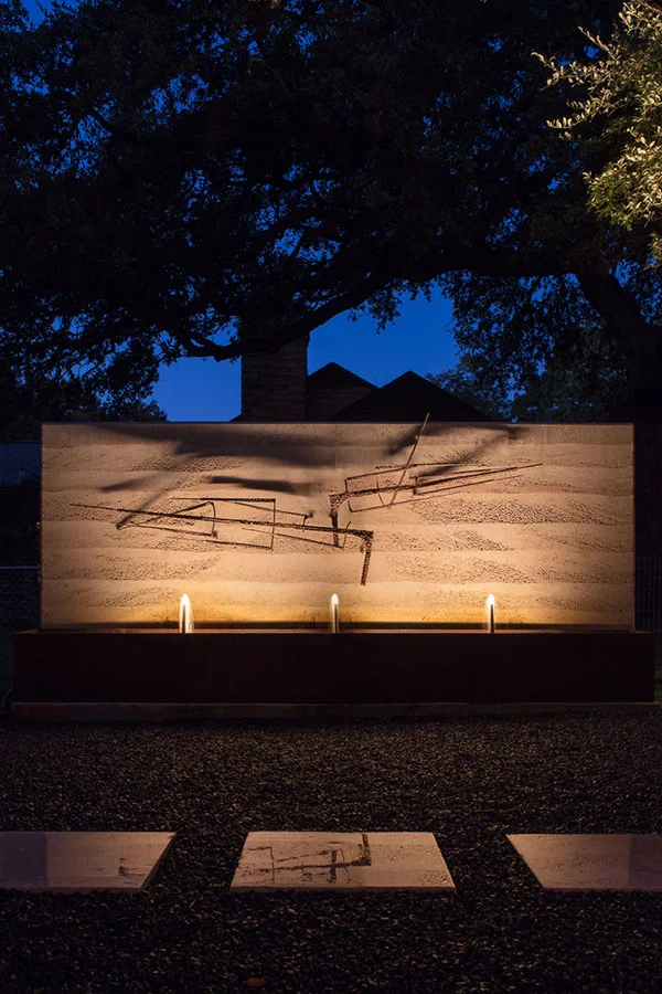 Water feature/rammed earth wall in Courtyard 1 at night
