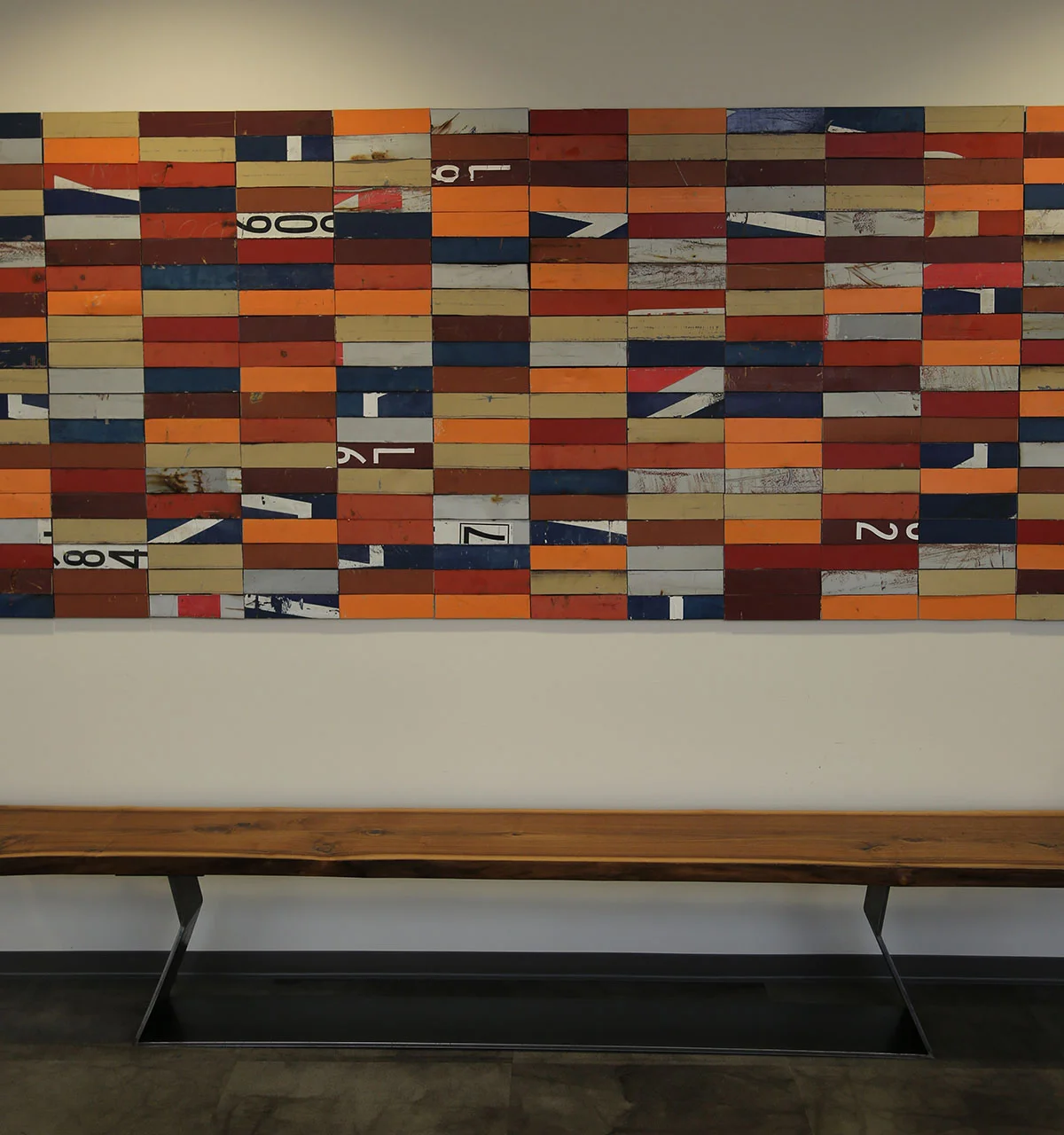 Lived edge/steel bench as well as wall artwork created with segments of reclaimed shipping containers by John Whitmarsh - selected and coordinated by DHD
