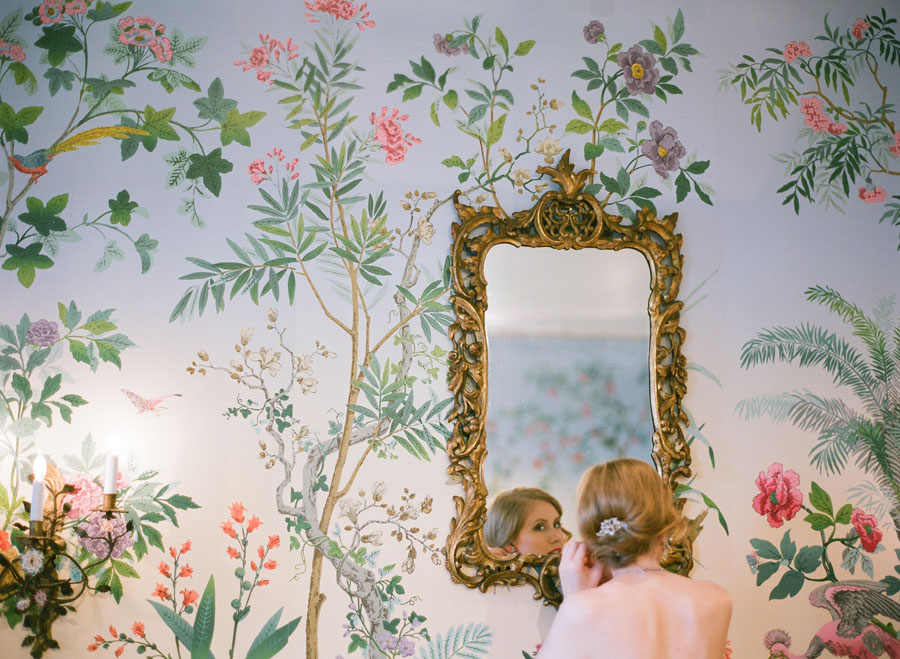 bride getting ready in wallpaper room at Villa Terrace Milwaukee