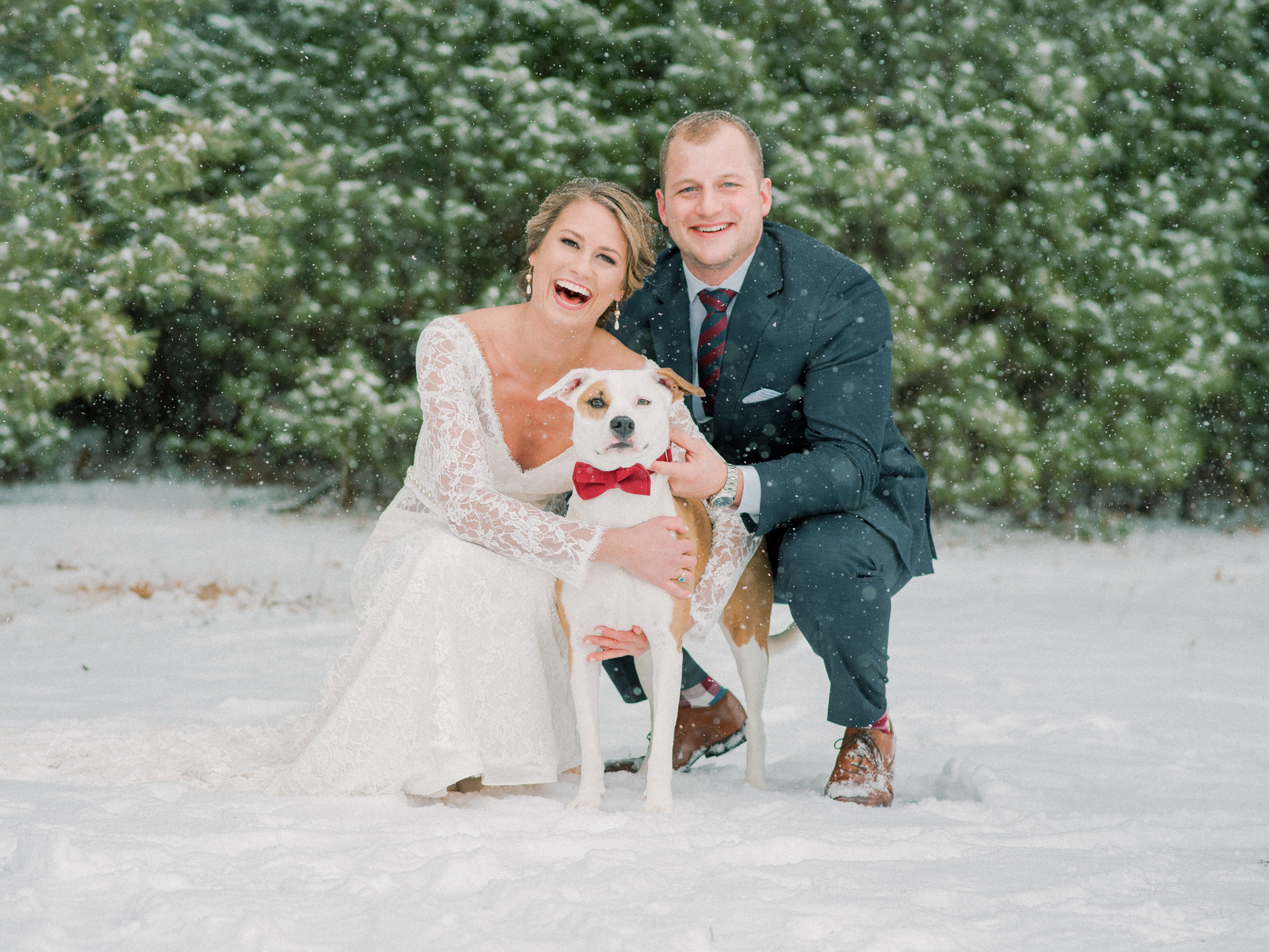 bride and groom with their dog ring bearer