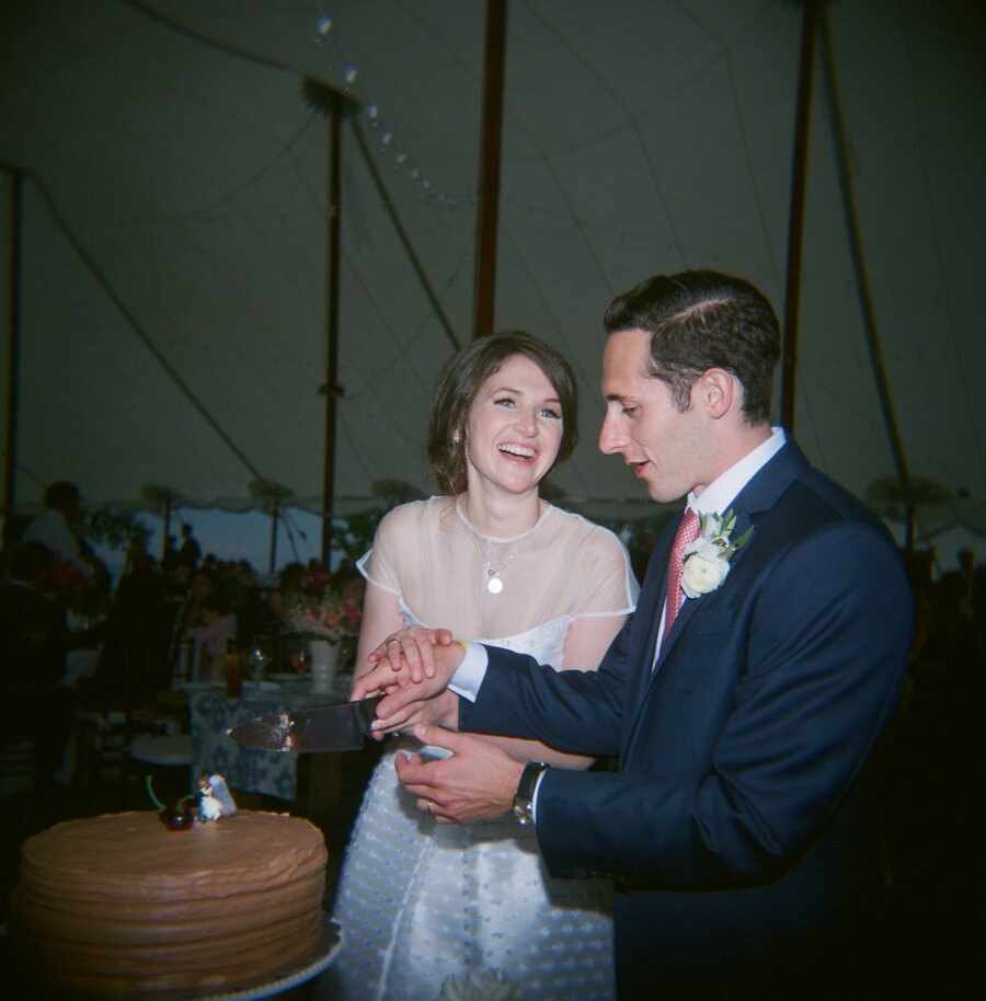 Bride and Groom cake cutting captured on film with a Holga