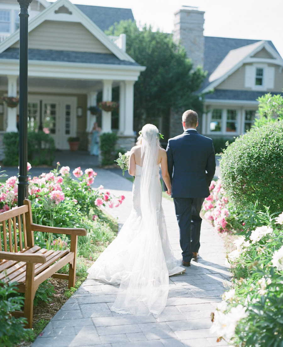 Bride and groom walk to their reception at Horseshoe Bay Golf Club