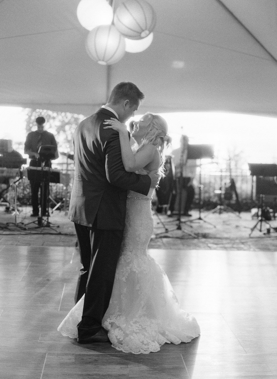 Bride and groom's first dance on black and white film