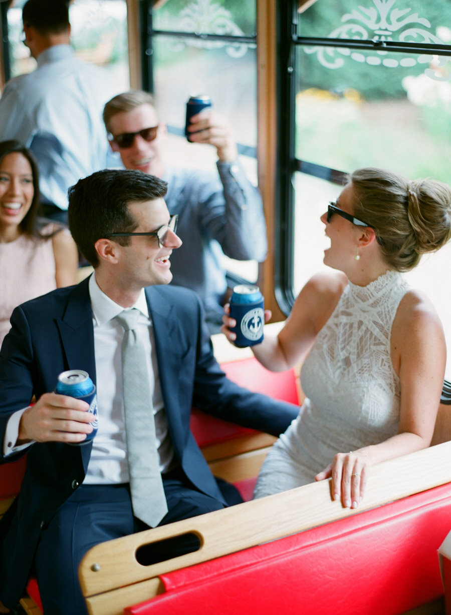 Bride and Groom cheers on a Door County Trolly