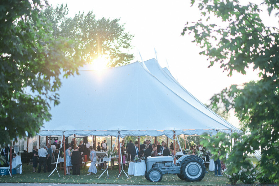 Sail cloth tented reception at sunset in door county