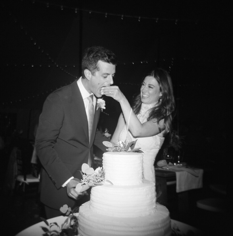 bride and groom cut the cake in door county