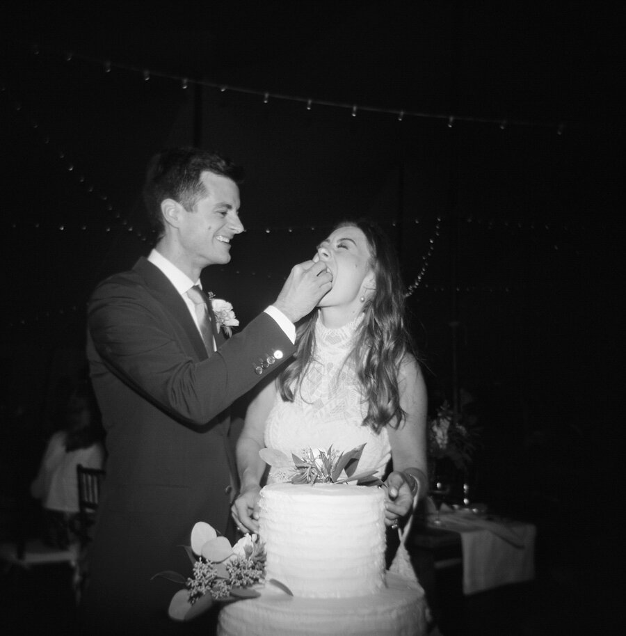 bride and groom cut the cake in door county