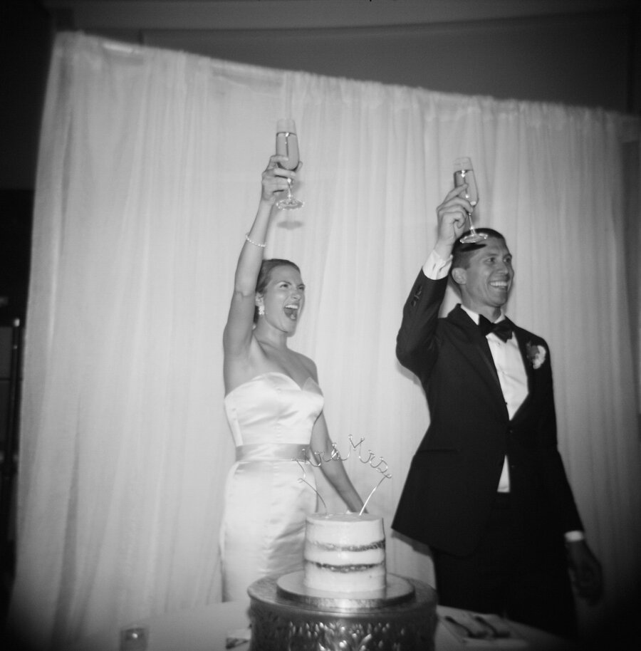 cake cutting photographed with holga film camera at wisconsin wedding