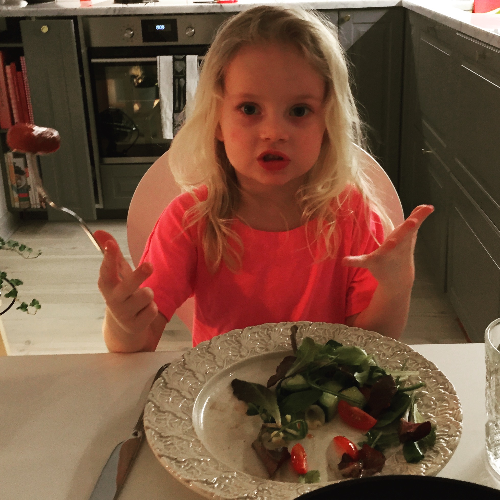 You know she's saying something important when she's waving around that little hot dog like that!