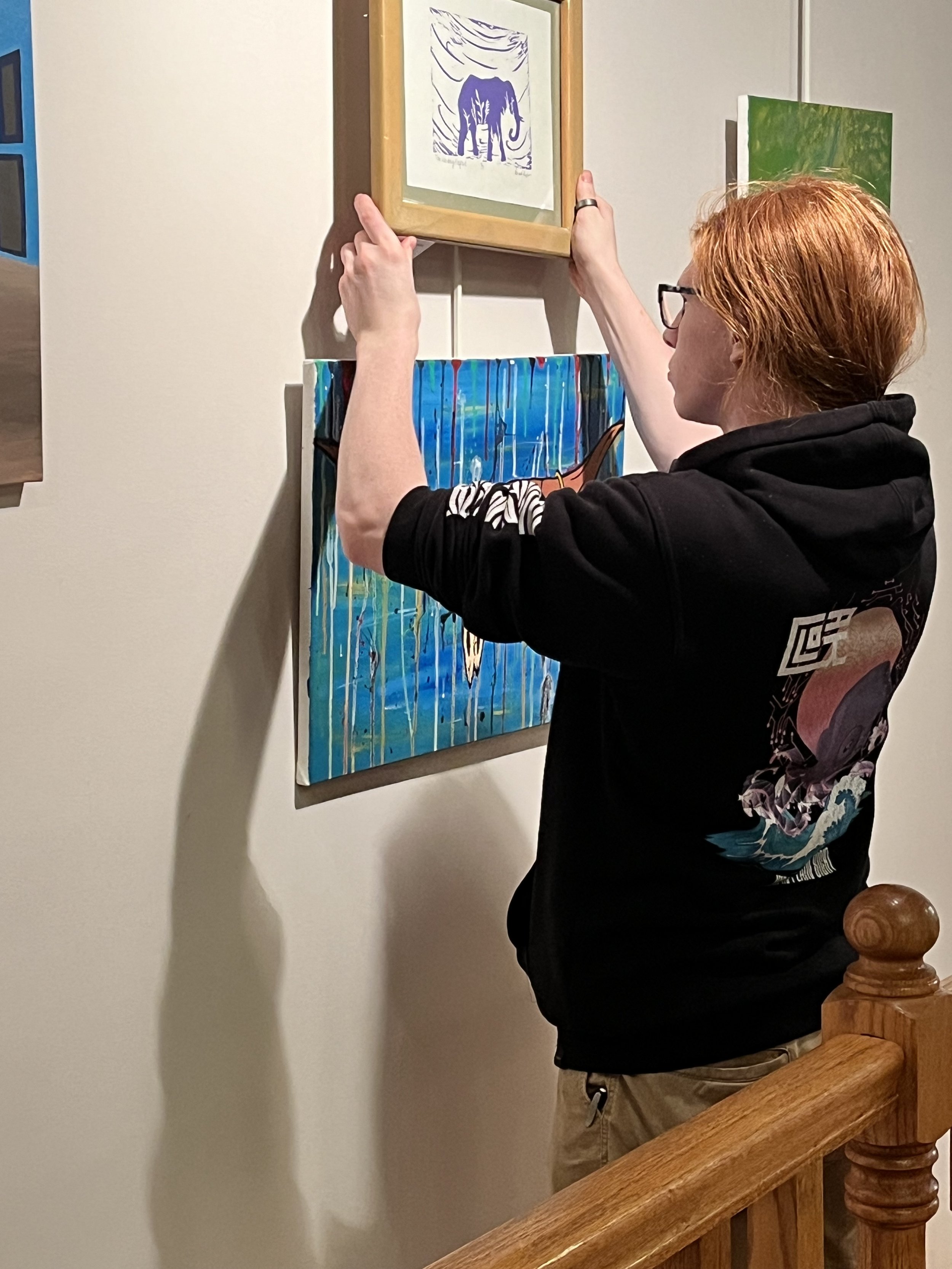 D&E Student Assists in Hanging an exhibition.jpg