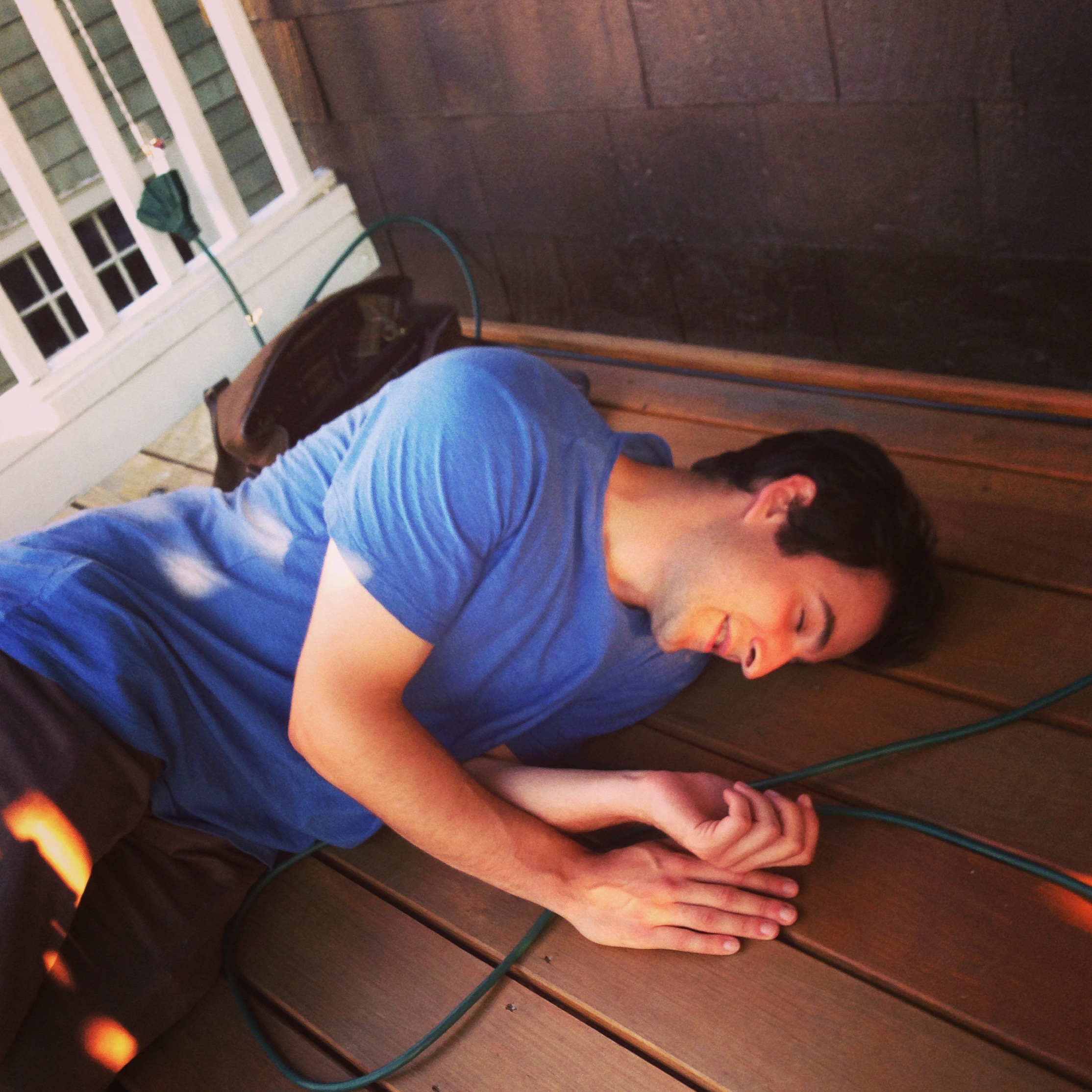 My cousin Steve struggles on the porch of me and Natalie's apartment, up the street from his, in Somerville, Massachusetts.