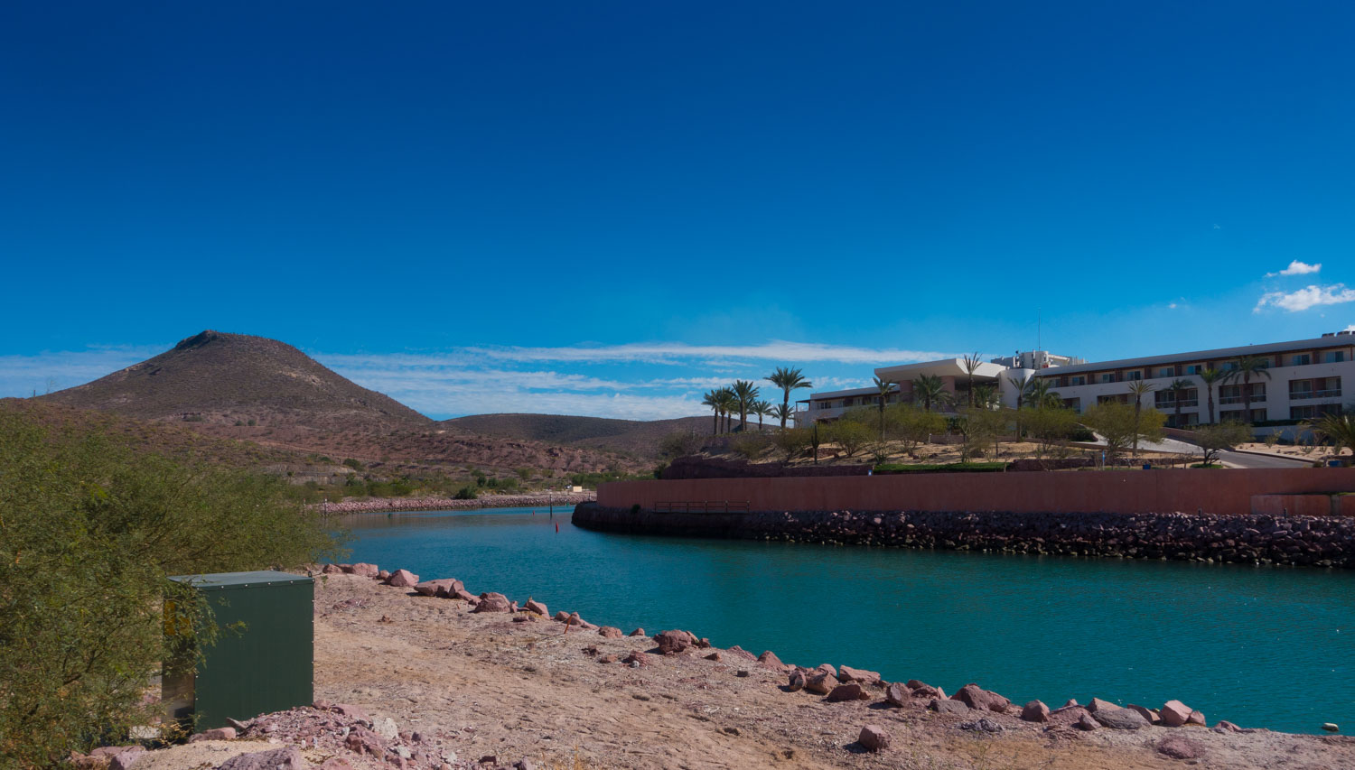 The narrow channel, blasted from the desert that leads to the inner harbor at Costa Baja Marina.