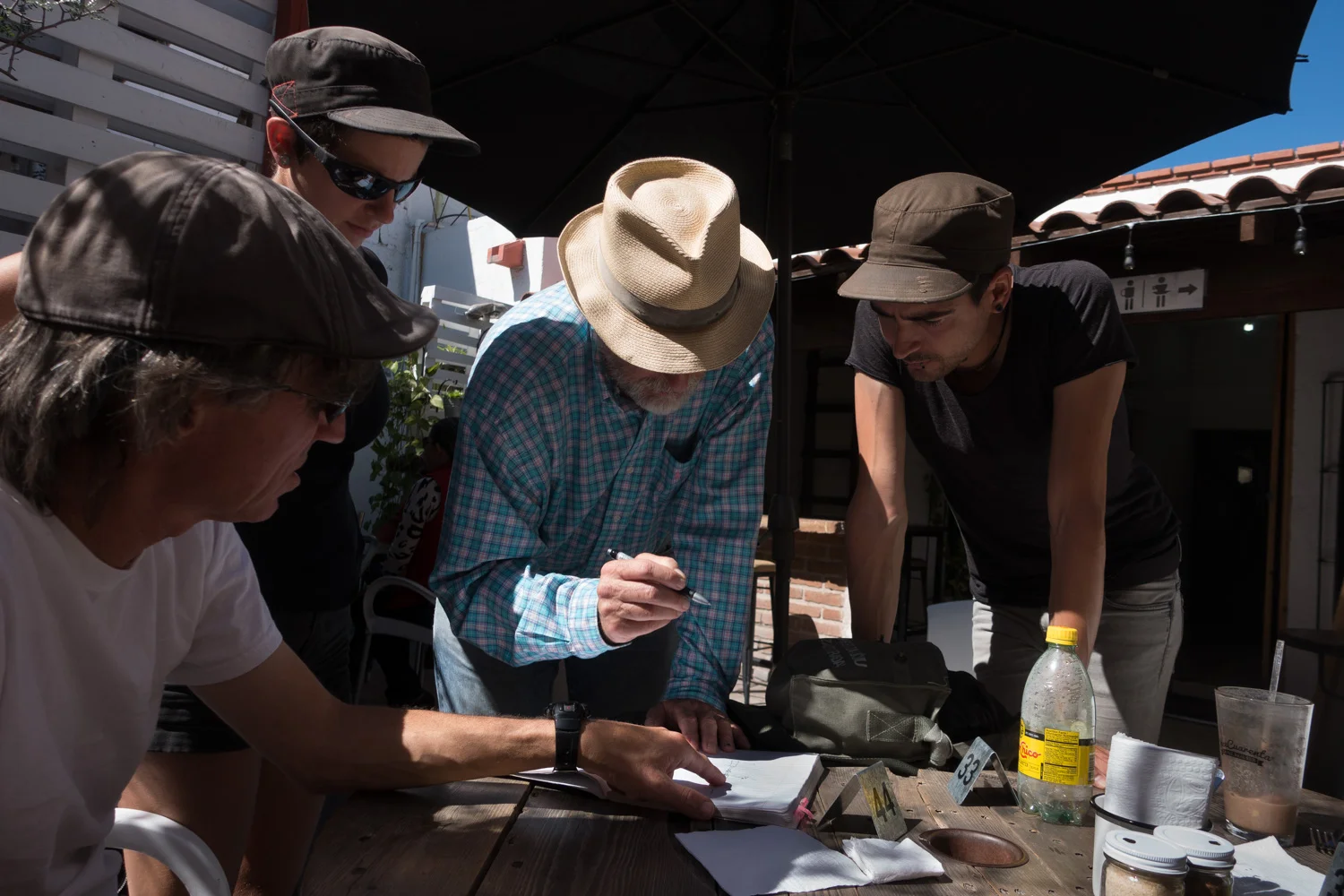 Crew from Essencia, Pino and Tumbleweed going over the finer points of a Monitor windvane.