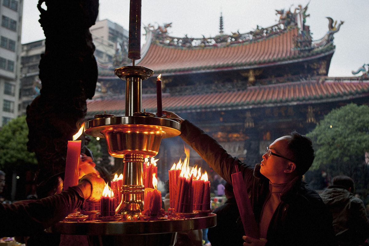 Man Lighting Candle in Taipei