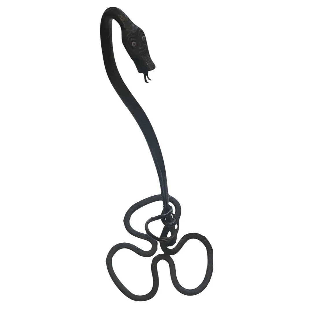 I don’t know the original use for this (watch holder?) but I was so taken by the form that it didn’t matter. The base and writhing bits are my favorite; plus, it’s hard to be scared by a snake with googly eyes. Hang your keys from its forked tongue