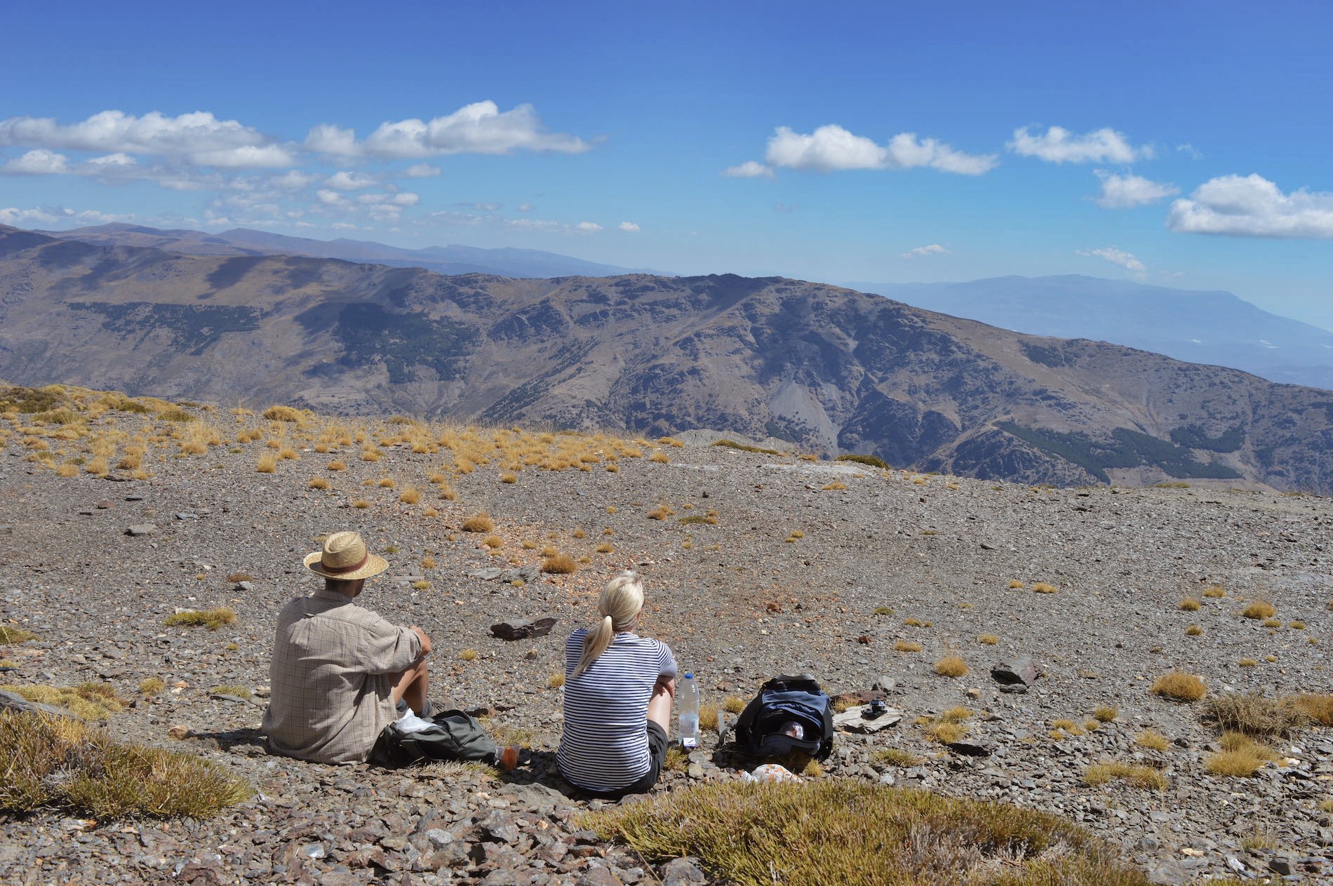 My wife Amanda and Jaime (from the fabulous La Placeta in Portugos, southern Spain) quietly sitting, looking over the many mountains and out towards the coast of North Africa as part of our trek from Portugos to Trevelez.