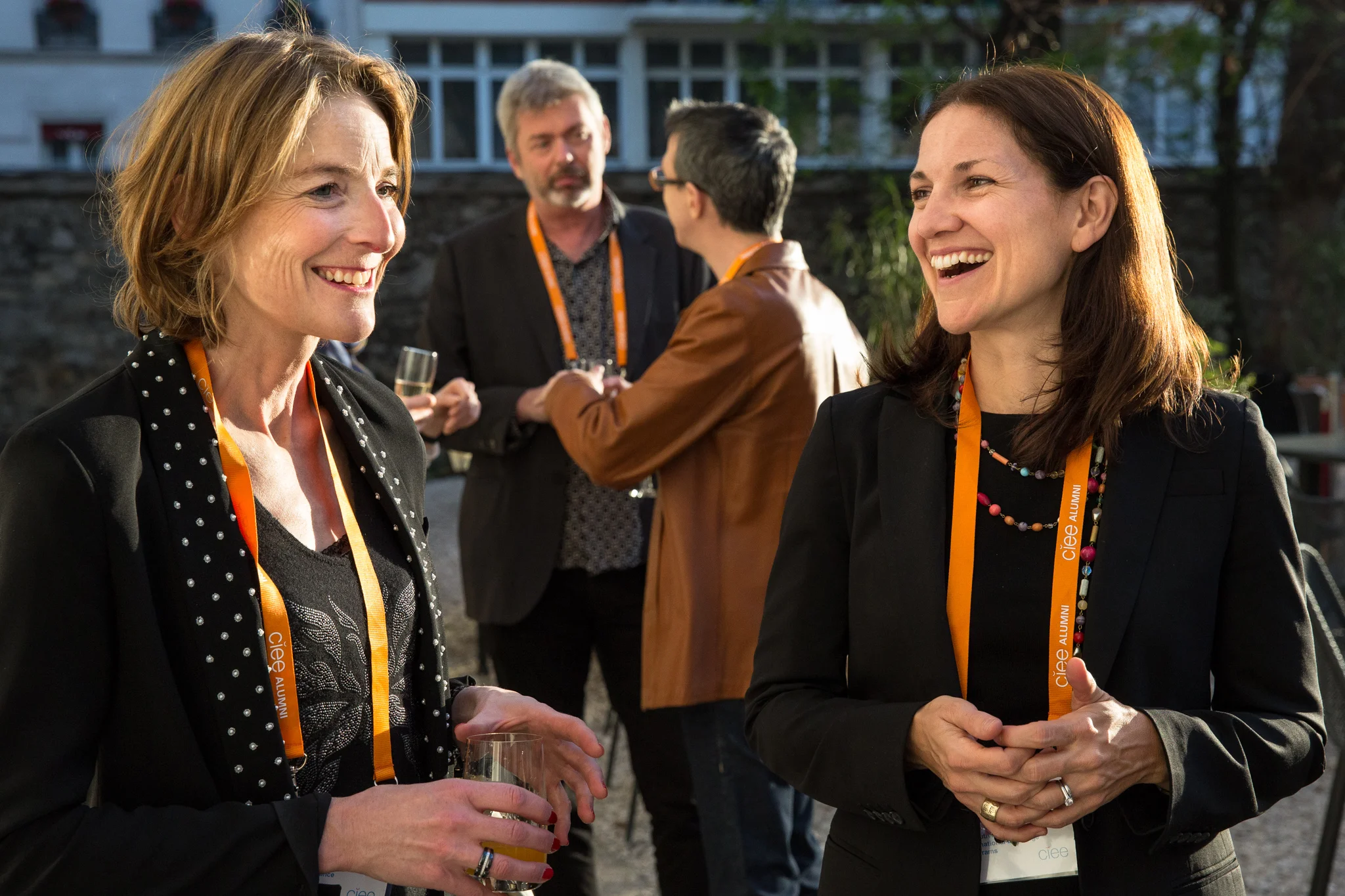 people conversing at networking event