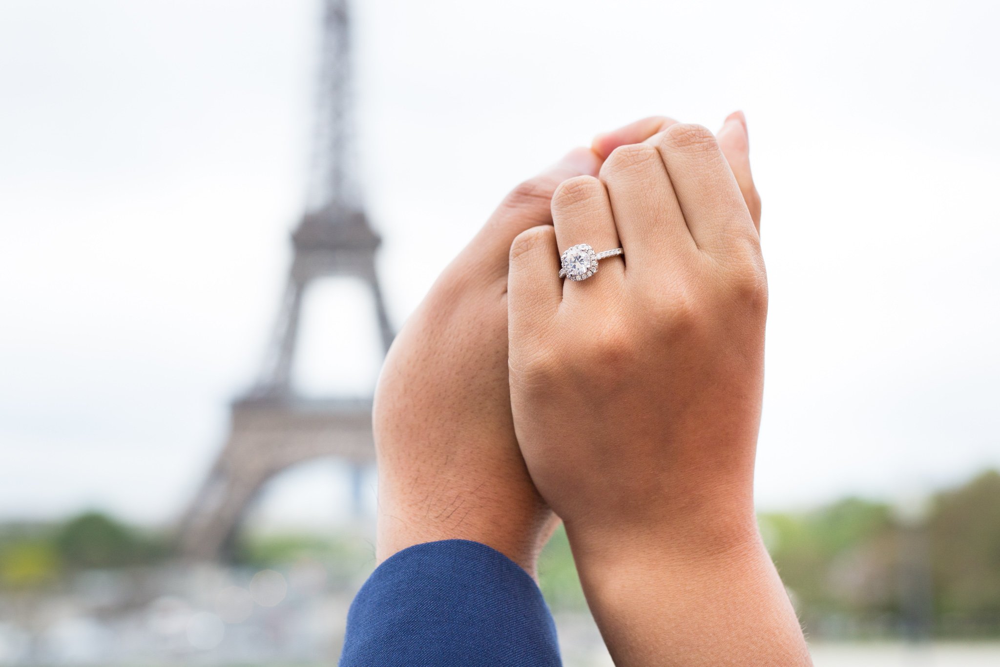  couple-holds-hands-with-close-up-on-wedding-ring 