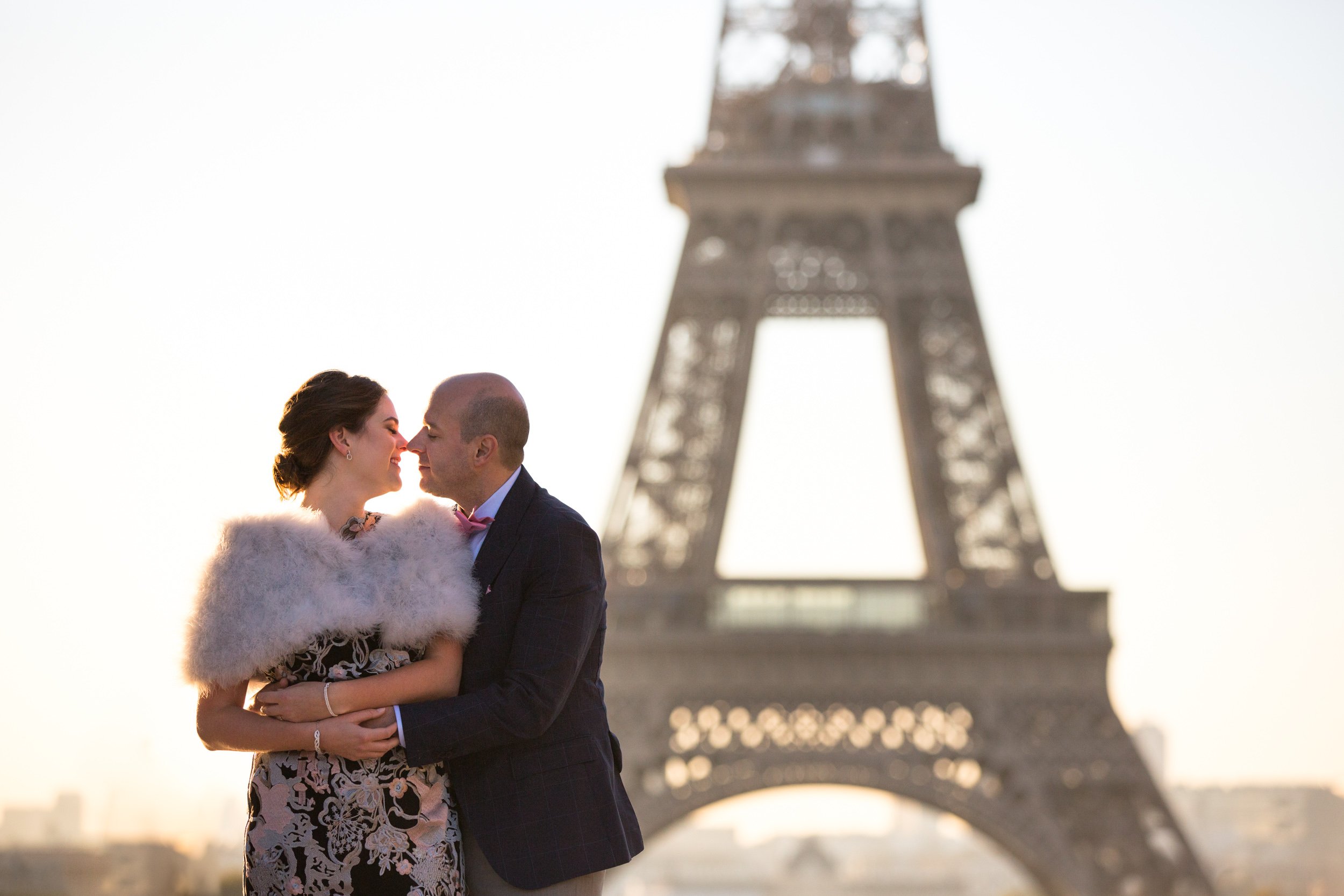  couple-embrace-by-eiffel-tower-at-golden-hour 