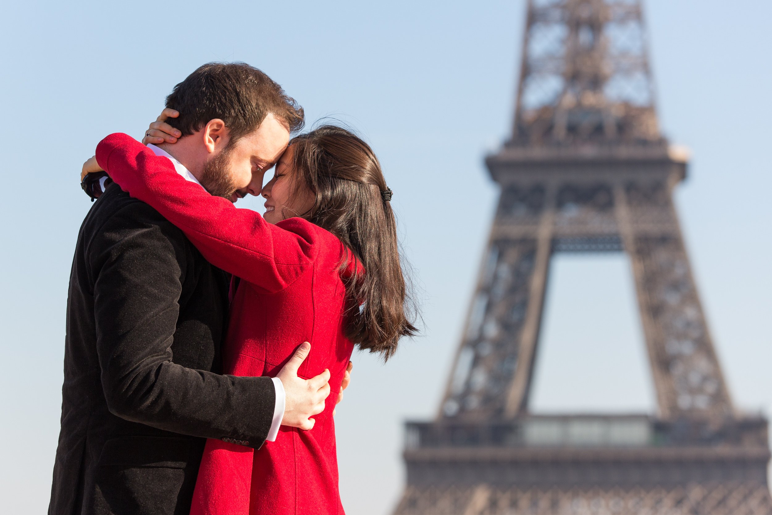  stylish-couple-embrace-with-eiffel-tower-in-background 