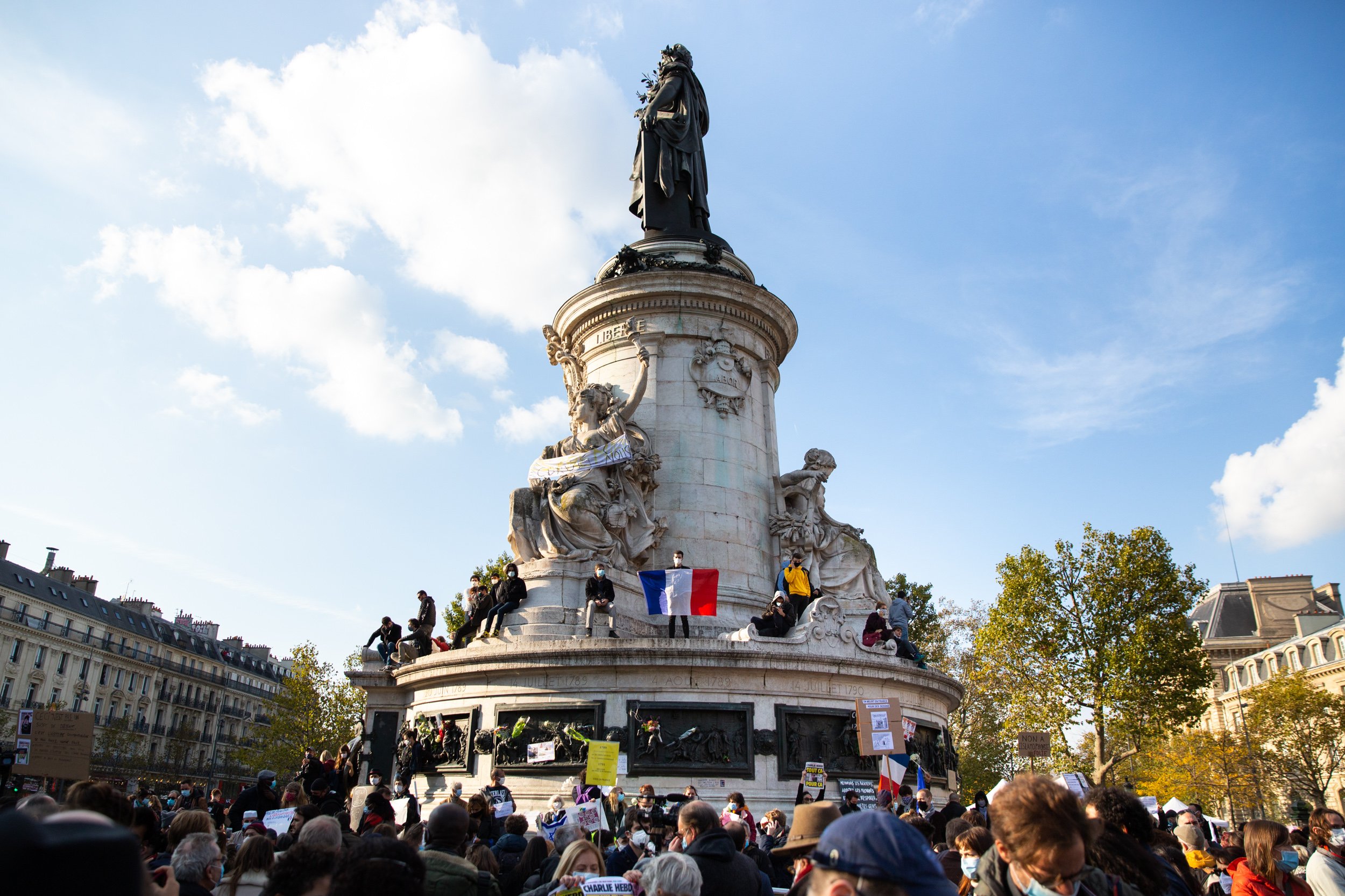  french-flag-held-up-at-paris-demonstration 