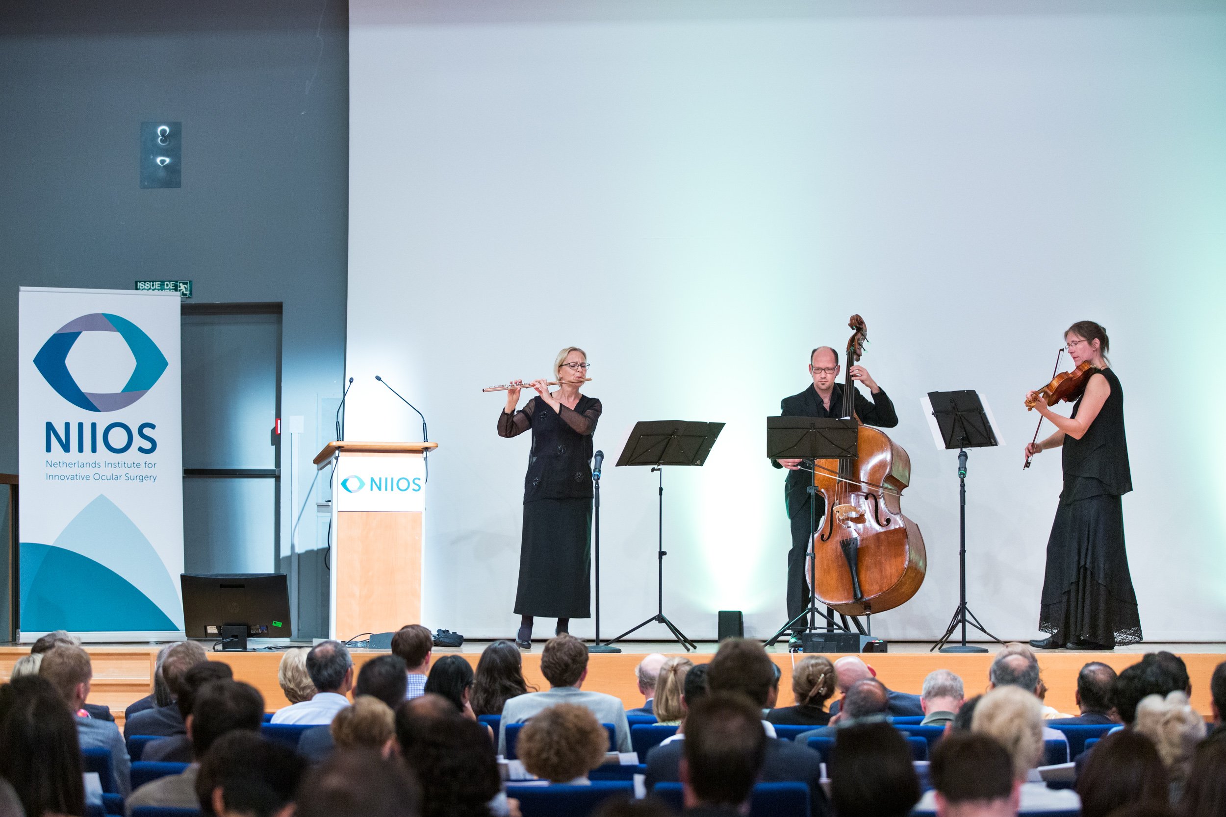  trio-of-classical-musicians-on-stage 