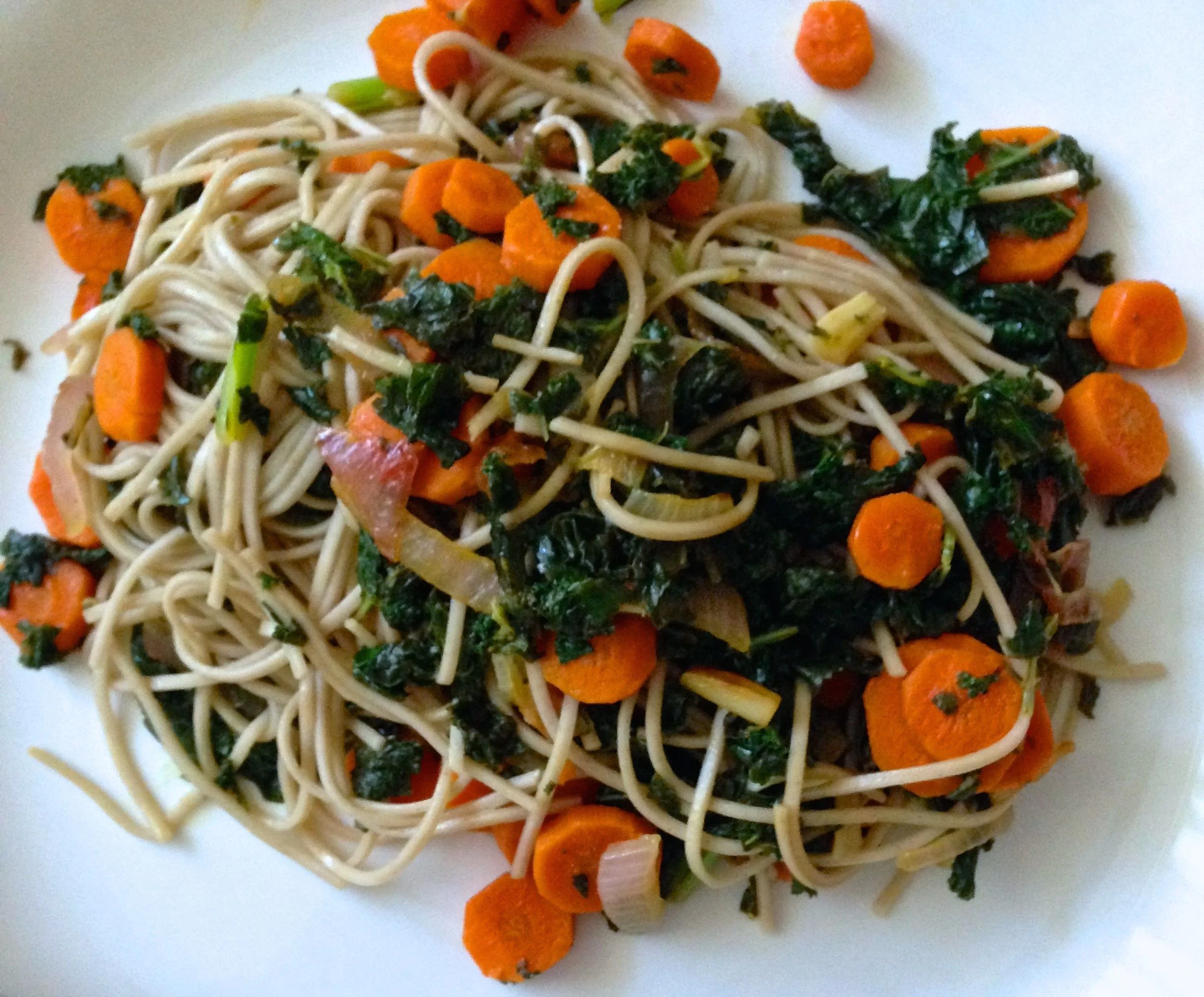 Soba noodles tossed with kale, carrots and tamari