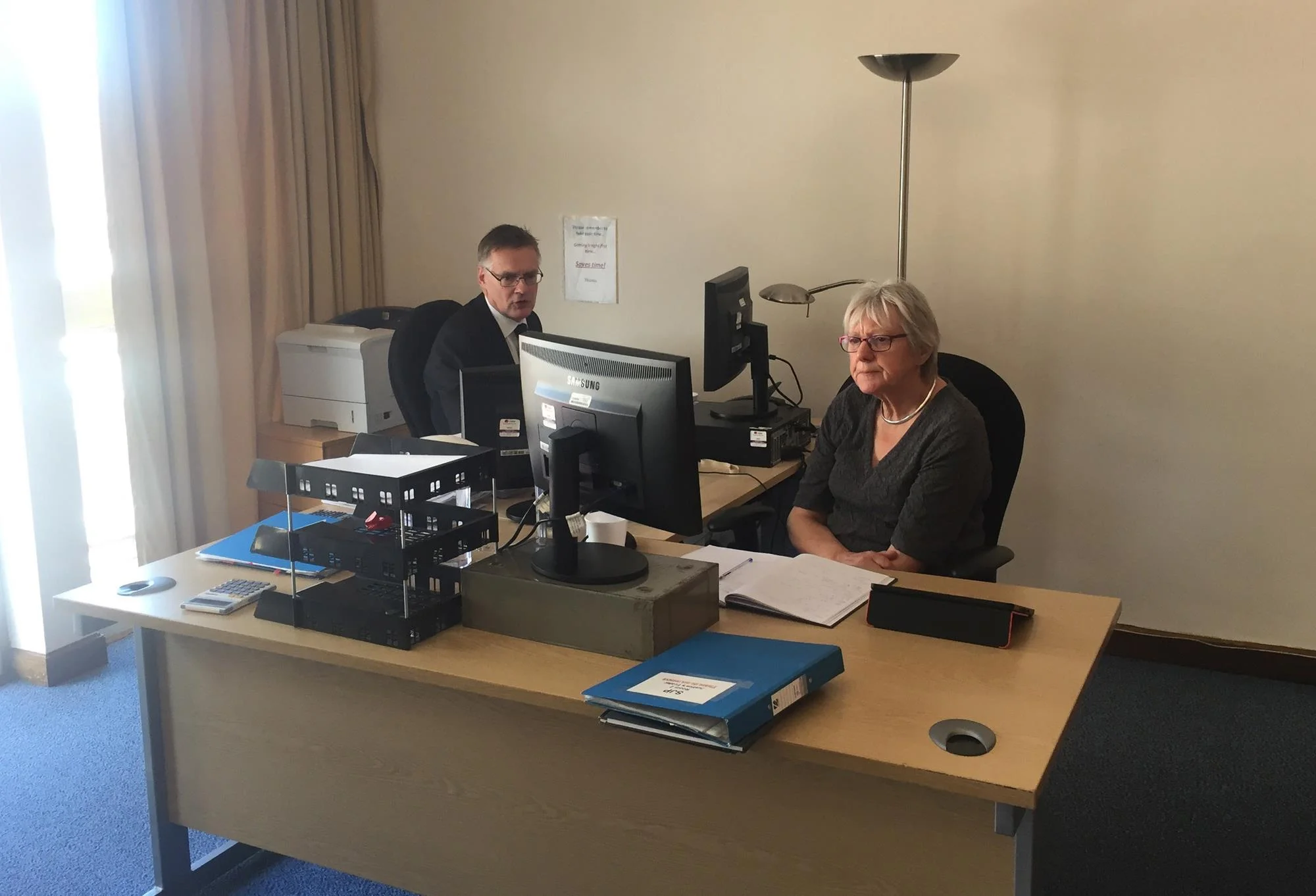 Court clerk (legal adviser) shown here advising a Justice of the Peace (Magistrate). Photo credit: Law Society Gazette.