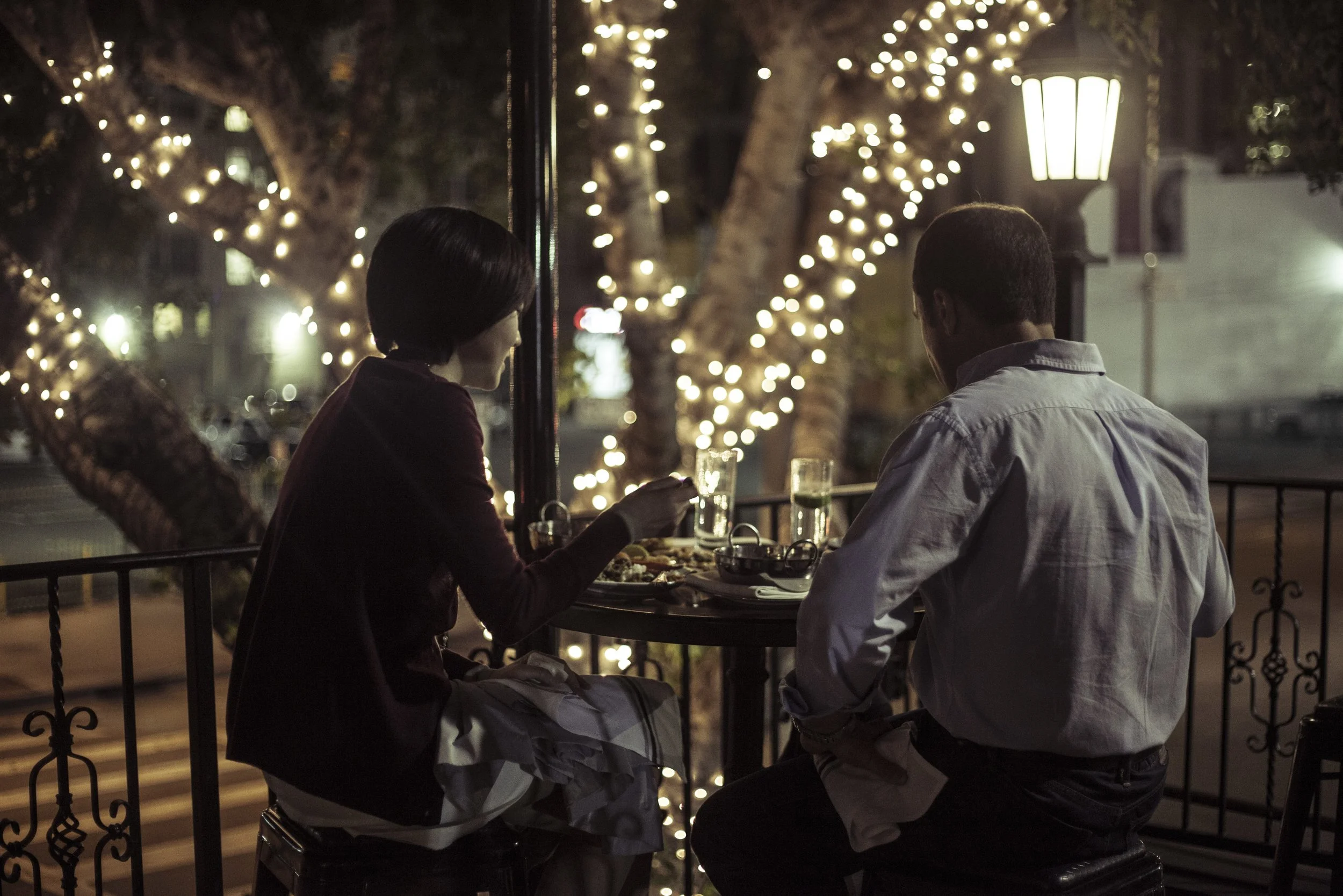 Couple Dining on Balcony at night