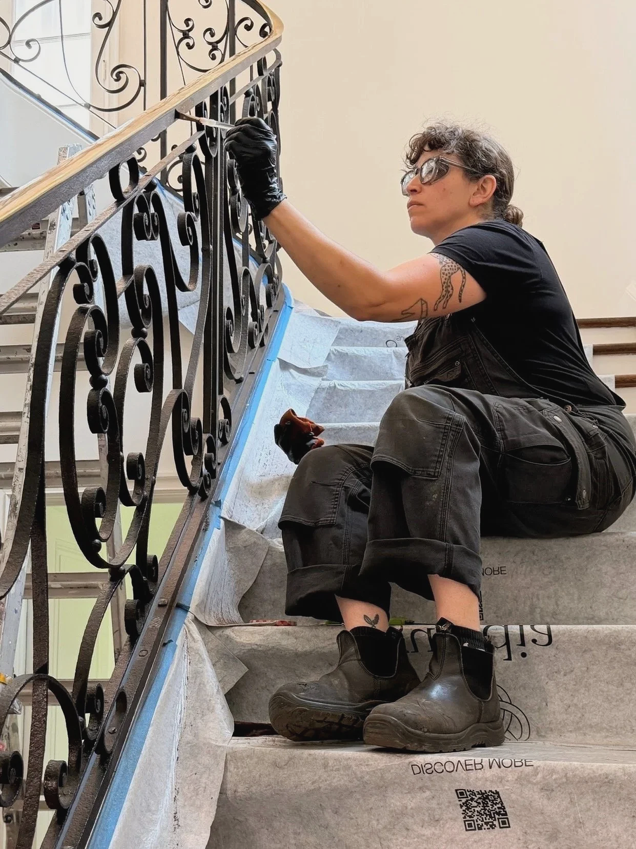 Amy Weiks of Smith Shop at work restoring an 18th century french railing.