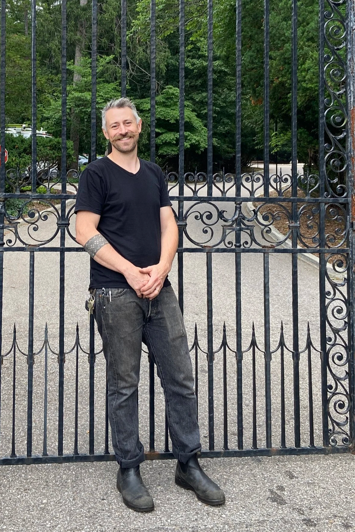 Gabriel Craig stands at the South Gate entrance to Cranbrook House.