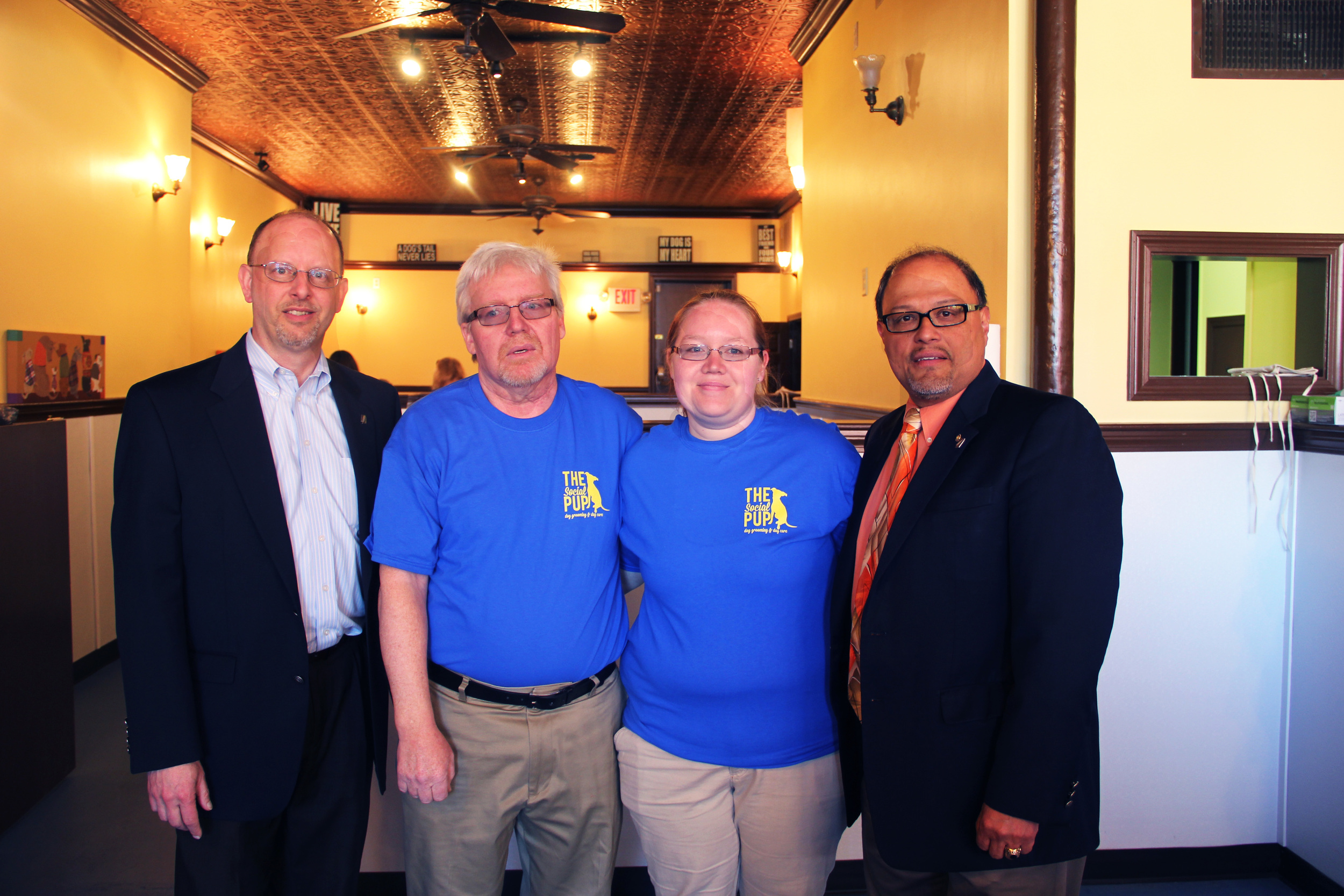Sarah, founder of The Social Pup, with her father and supporters.