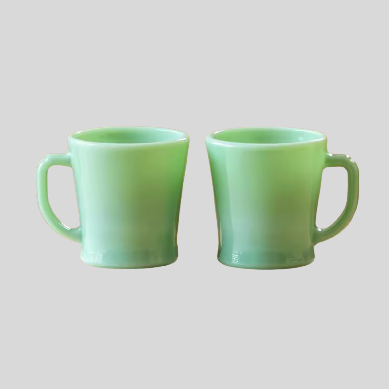 Green jade milk glass mug on a grey background